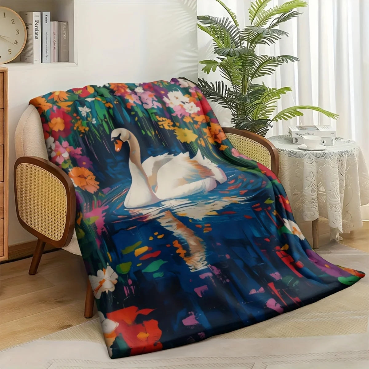 A cozy swan and floral-themed flannel blanket - soft and warm, perfect for camping, sofas, beds, and chairs, a great holiday gif